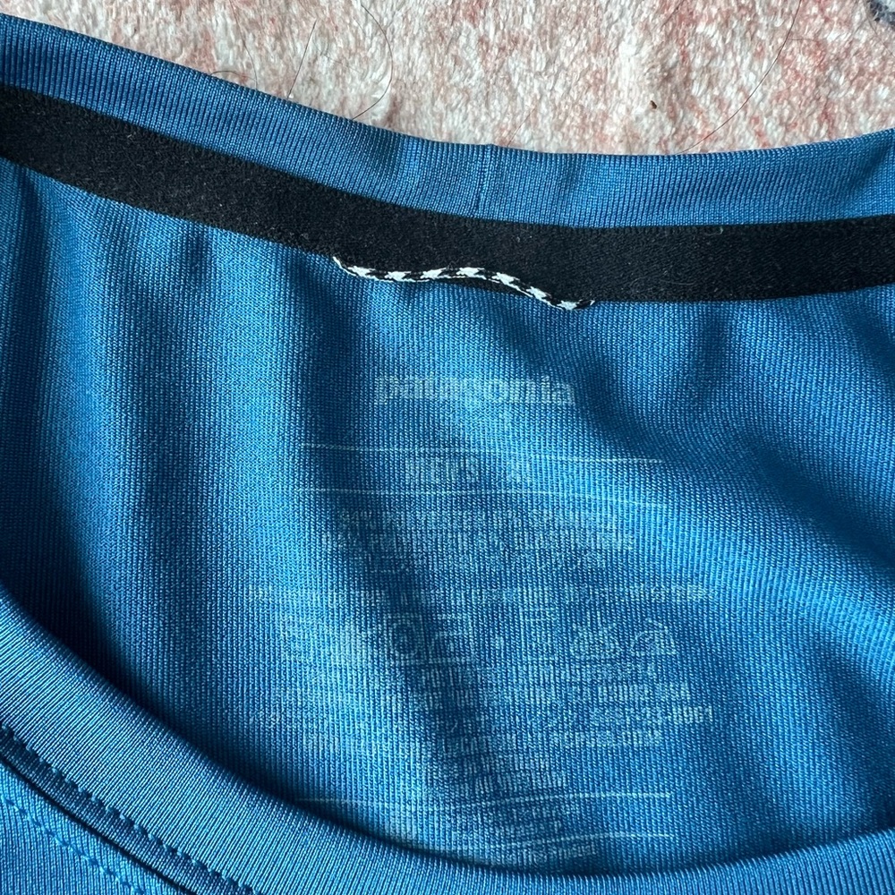 XL blue short sleeve Patagonia top. Athletic material